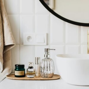A stylish bathroom sink with skincare products and accessories for modern living.